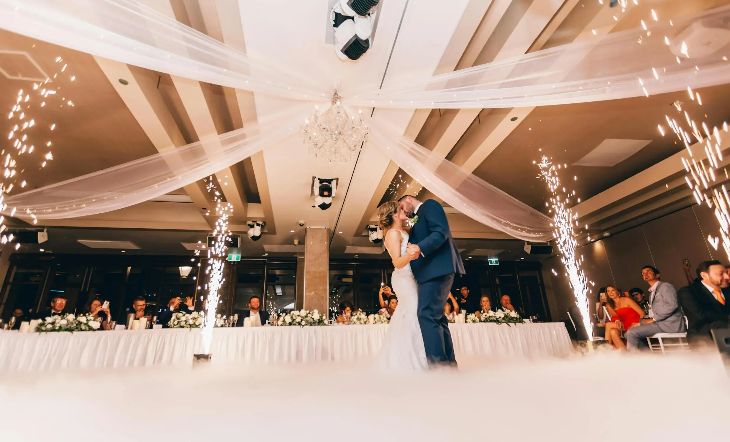 Joyful couple dancing at their wedding reception